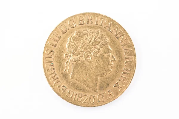 A close-up of a gold coin displaying a man's portrait, highlighting its craftsmanship and shiny surface.