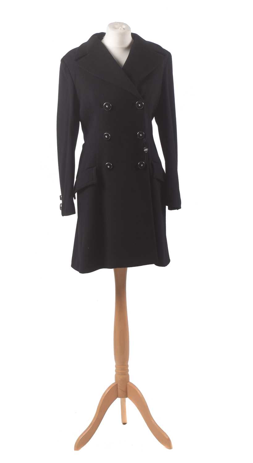 A black wool coat by Gianni Versace Couture, the mid length black wool coat with silver tone buttons bearing makers logo, size 42.