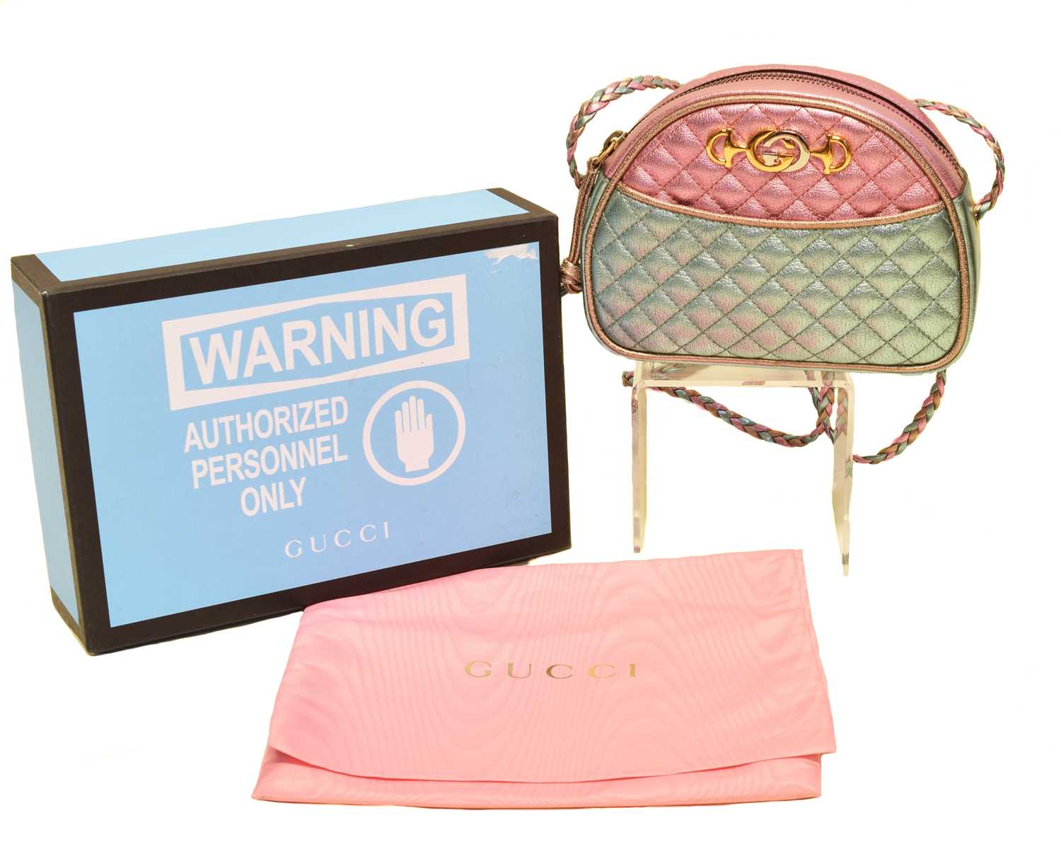A Gucci Trapuntata Crossbody Mini Bag, the metallic pink, blue and gold laminated quilted calf leather exterior, with interlaced leather shoulder straps, and gold and silver tone hardware, serial no. 534951-534563. With maker's detachable keyring, booklet, box and dustbag.