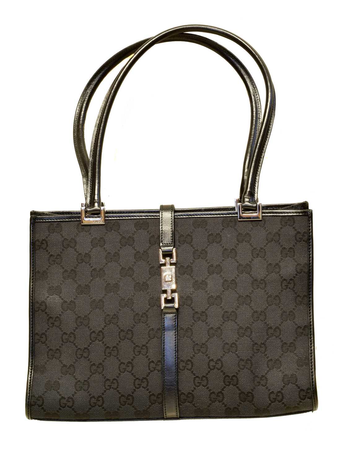 A Gucci Square Jackie Bag, the black monogrammed canvas exterior with black leather strap and ruthenium hardware, serial no. 002/1073/002214.