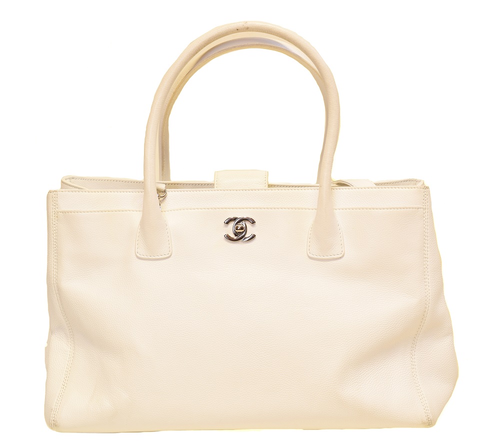 A Chanel Cerf Tote Shoulder Bag, circa 2008-9, the white grained calf leather exterior with white leather straps and silver-tone hardware, serial no. 12381545. With shoulder strap, maker's authenticty card and pouch. (Qty: 1) 35.5x23.5x12cm Sold for £1,269