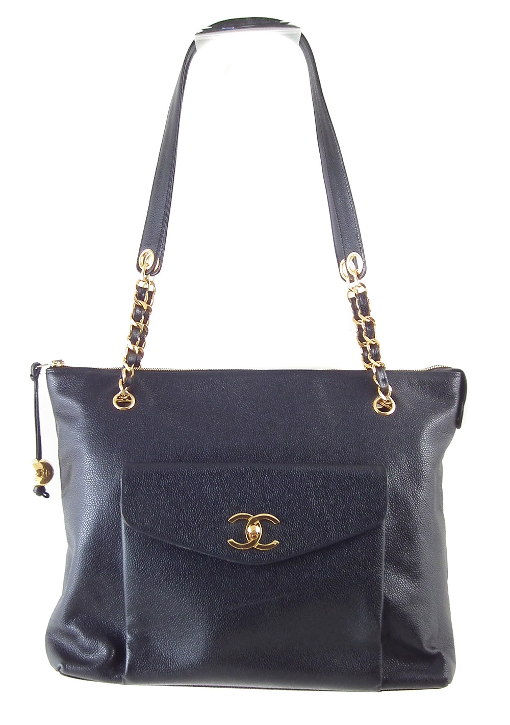 A Chanel CC Turnlock Shopping tote handbag, circa 1991-4, the black caviar leather, with front pocket and gold-tone double 'C' monogram, double woven leather and gold-tone straps with leather shoulder panels, lambskin leather lining, zip compartment, serial number 2896749, with care card and booklet. Dimensions 36 x 30 x 11cm. 36 x 30 x 11cm Sold for £1,220