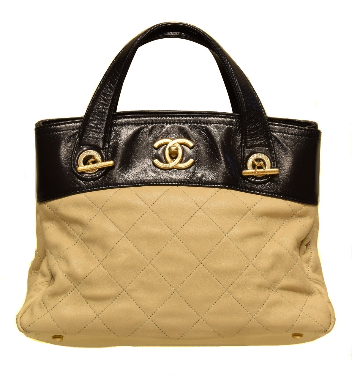 A Chanel In The Mix Shoulder Bag, circa 2012-3, the beige quilted calf leather exterior with smooth black leather detailing, gold tone hardware, interlace chain and black leather strap, serial no. 17422353. With maker's authenticity card and dust bag. 27x20x15cm Sold for £1,586